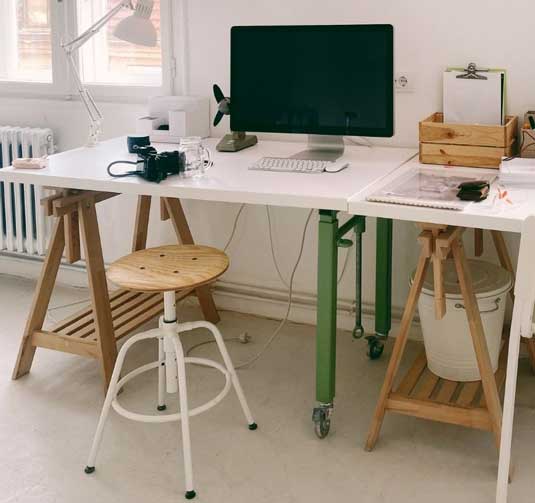 home office workspace with computer and digital camera