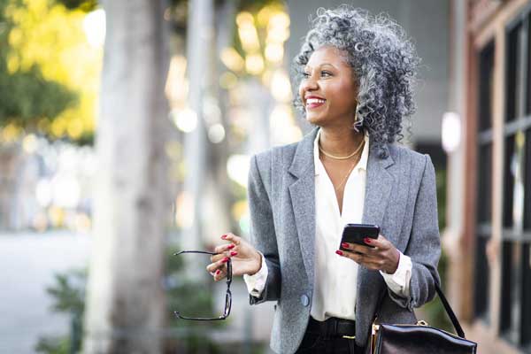 Image of women walking who is dressed in a business suit who works with Nonprofit Executive Search Services