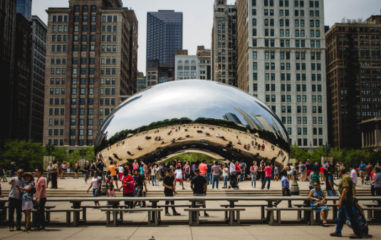 Chicago Nonprofit Staffing & Recruiting Agency image of the Bean sculpture in Chicago with people around it