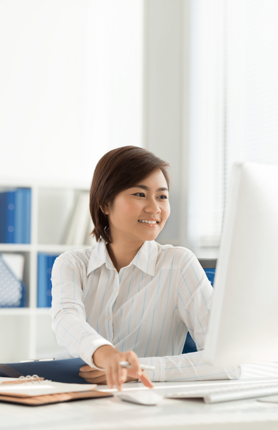 Direct Hire Administrative Recruiting - image of diverse woman doing administrative work in professional office